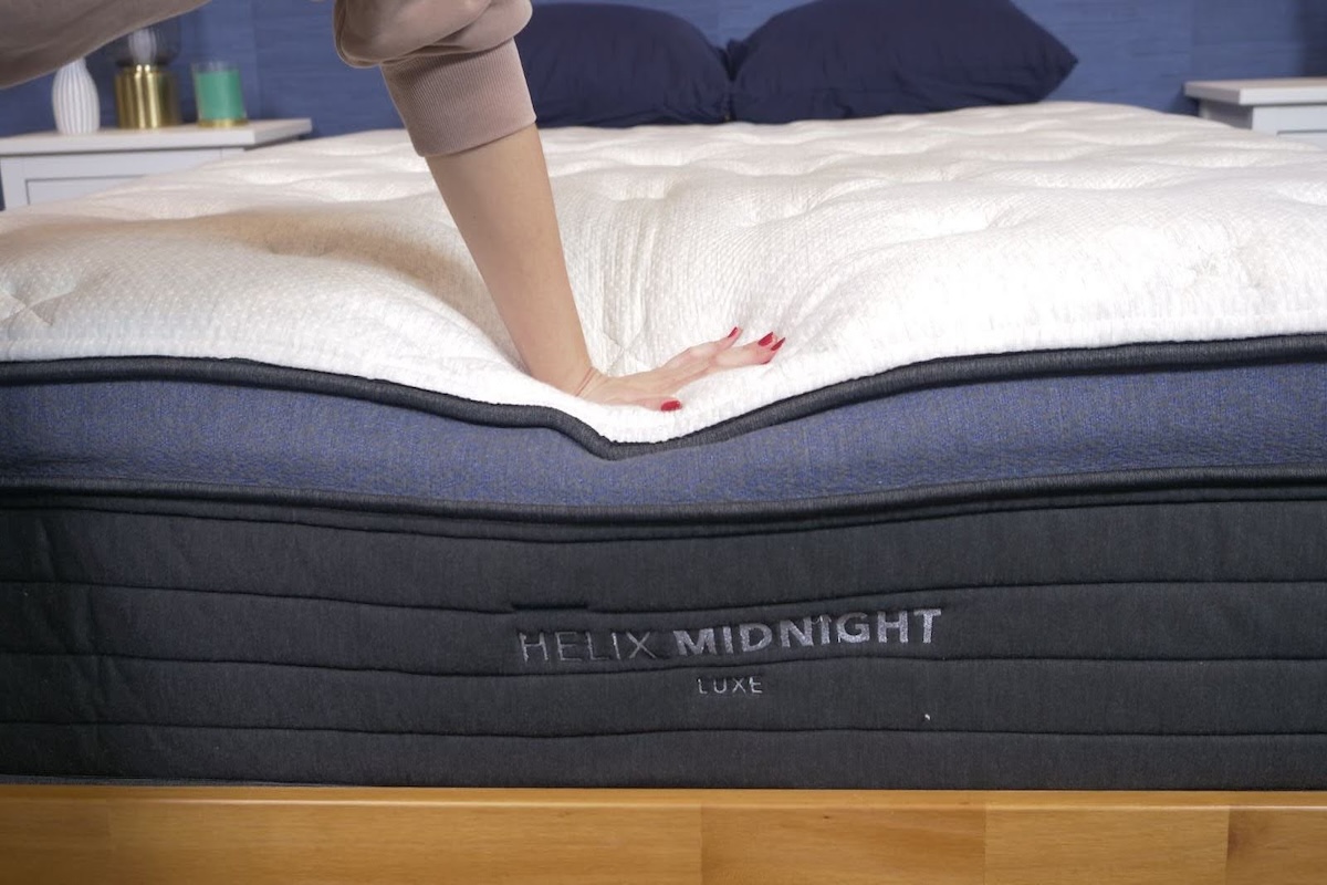 Tester pressing through the Helix Midnight Luxe pillow top. 